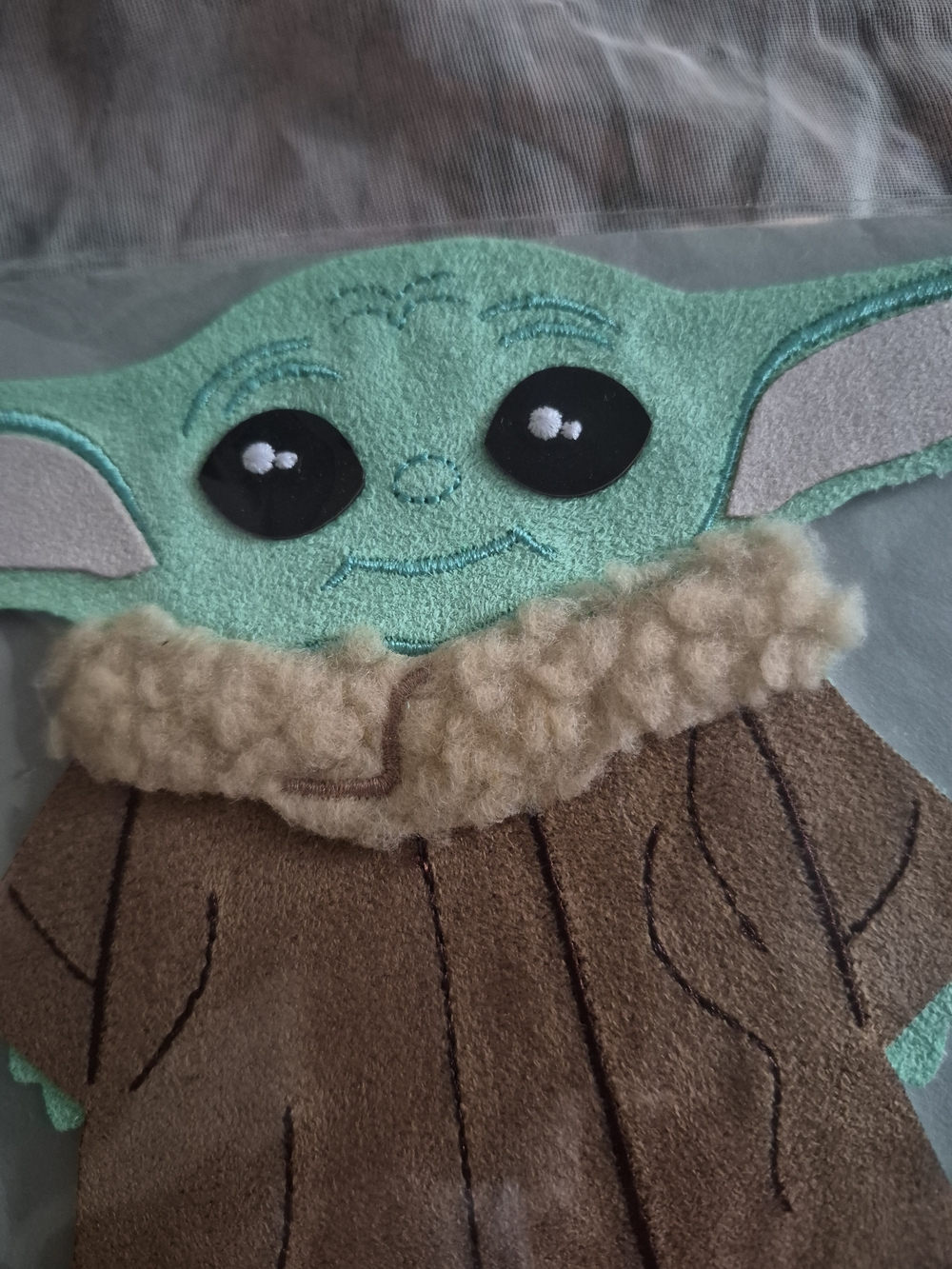 Papyrus Green Character Bib with Brown Coat and Cream Collar